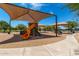 Community playground featuring slides, climbing structures, and sunshade for outdoor fun at 5240 E Gummite Dr, San Tan Valley, AZ 85143