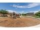 Community playground featuring climbing structures, slides, and walking paths at 5240 E Gummite Dr, San Tan Valley, AZ 85143