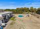 Expansive backyard features the home's outdoor amenities, landscaping, covered patio, and refreshing pool at 5827 S Marin Ct, Gilbert, AZ 85298