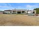 Home's backyard features a covered patio, outdoor seating, a refreshing pool, and low-maintenance landscape at 5827 S Marin Ct, Gilbert, AZ 85298