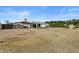 Wide backyard view reveals the home's exterior, landscaping, and outdoor living potential at 5827 S Marin Ct, Gilbert, AZ 85298