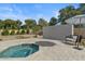 Inviting plunge pool with custom tile wall and lounge chair provides a serene outdoor experience at 5827 S Marin Ct, Gilbert, AZ 85298