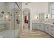 Primary bathroom showcasing a glass shower, freestanding tub, and decorative tile accents at 5827 S Marin Ct, Gilbert, AZ 85298