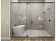 Sleek bathroom features a glass-enclosed shower, soaking tub, and modern fixtures at 5827 S Marin Ct, Gilbert, AZ 85298