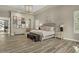 Large main bedroom with wood floors, recessed lighting, and neutral decor at 5827 S Marin Ct, Gilbert, AZ 85298