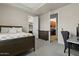 Neutral toned bedroom showing attached walk-in closet and laundry room at 5827 S Marin Ct, Gilbert, AZ 85298