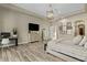 Neutral colored main bedroom with wood floors, recessed lighting, and decor art at 5827 S Marin Ct, Gilbert, AZ 85298