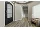 Home foyer showcasing tile flooring, accent walls, and seating area at 5827 S Marin Ct, Gilbert, AZ 85298