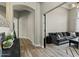 Hallway and living room featuring tile flooring, neutral walls, and modern decor at 5827 S Marin Ct, Gilbert, AZ 85298