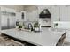 Stylish kitchen with a large island, white countertops, and modern stainless steel appliances at 5827 S Marin Ct, Gilbert, AZ 85298