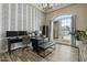Office boasts stylish accent wall, wood floors, and French doors to backyard at 5827 S Marin Ct, Gilbert, AZ 85298