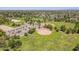 View shows park baseball fields, parking, playgrounds and green space in the surrounding neighborhood at 6231 E Desert Cove Ave, Scottsdale, AZ 85254