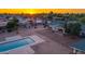 Aerial view of the backyard featuring a pool, patio, and grassy area at 6231 E Desert Cove Ave, Scottsdale, AZ 85254