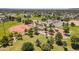 Aerial view of park with baseball fields, parking, playground, and mature trees in community at 6231 E Desert Cove Ave, Scottsdale, AZ 85254