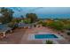 A private backyard with a pool and mature landscaping at 6231 E Desert Cove Ave, Scottsdale, AZ 85254