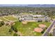 View shows park with baseball fields, tennis courts, parking, and green space near neighborhood school at 6231 E Desert Cove Ave, Scottsdale, AZ 85254