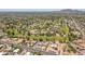 Aerial view of a lush golf course community with winding fairways, mature trees, and beautiful homes at 6231 E Desert Cove Ave, Scottsdale, AZ 85254