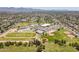 The aerial view showcases neighborhood school with baseball fields, tennis courts, parking, and green space at 6231 E Desert Cove Ave, Scottsdale, AZ 85254