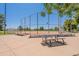 Sunny baseball field with a chain-link fence and seating, set against a clear blue sky at 6231 E Desert Cove Ave, Scottsdale, AZ 85254