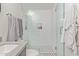Bathroom featuring updated vanity, stylish light fixtures and tiled glass shower at 6231 E Desert Cove Ave, Scottsdale, AZ 85254