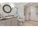 Bathroom featuring a granite sink, mirror and tile flooring at 6231 E Desert Cove Ave, Scottsdale, AZ 85254