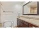 Bright bathroom featuring granite counters, a modern vanity and a decorative framed mirror at 6231 E Desert Cove Ave, Scottsdale, AZ 85254
