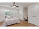 Bright bedroom featuring wood floors and a built-in desk with seating at 6231 E Desert Cove Ave, Scottsdale, AZ 85254