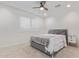 Bedroom showcasing plush carpeting, ceiling fan, shuttered window and a modern bed at 6231 E Desert Cove Ave, Scottsdale, AZ 85254