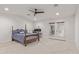 Spacious bedroom featuring plush carpet, modern ceiling fan and private access to the outdoors at 6231 E Desert Cove Ave, Scottsdale, AZ 85254