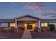 A charming home entrance with a covered porch and brick accents under a picturesque sky at 6231 E Desert Cove Ave, Scottsdale, AZ 85254