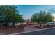 Inviting front exterior with lush landscaping and a brick driveway at 6231 E Desert Cove Ave, Scottsdale, AZ 85254