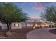 Charming single-story home featuring a well-manicured front yard and walkway under a picturesque sky at 6231 E Desert Cove Ave, Scottsdale, AZ 85254