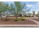 Charming single-story home featuring a well-manicured front yard and walkway under a picturesque sky at 6231 E Desert Cove Ave, Scottsdale, AZ 85254