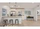 Bright kitchen featuring a breakfast bar with seating and stainless steel appliances at 6231 E Desert Cove Ave, Scottsdale, AZ 85254