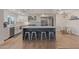 Spacious kitchen featuring an island with stool seating, stainless steel appliances, and pendant lighting at 6231 E Desert Cove Ave, Scottsdale, AZ 85254