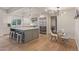 Bright, modern kitchen features stainless steel appliances, an island, and an open concept dining area at 6231 E Desert Cove Ave, Scottsdale, AZ 85254
