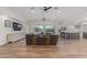 Spacious living room with hardwood floors, recessed lighting, and sliding glass doors leading to the backyard at 6231 E Desert Cove Ave, Scottsdale, AZ 85254