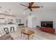 Open living area features a kitchen, ceiling fan, and tile flooring at 6231 E Desert Cove Ave, Scottsdale, AZ 85254