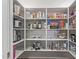 Walk-in pantry with plentiful shelving for optimal organization at 6231 E Desert Cove Ave, Scottsdale, AZ 85254