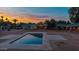 A beautiful pool reflecting the colors of the sunset at 6231 E Desert Cove Ave, Scottsdale, AZ 85254