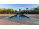 Backyard pool features concrete tile and landscaping at 6231 E Desert Cove Ave, Scottsdale, AZ 85254