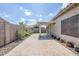 Serene backyard with a covered patio, a brick-paved area, rock landscaping, and plants for relaxation and enjoyment at 6317 S Kimberlee Way, Chandler, AZ 85249