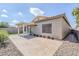 Inviting backyard with a covered patio, paved area, rock landscaping, and artificial grass, ideal for entertaining at 6317 S Kimberlee Way, Chandler, AZ 85249