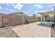 Charming backyard with a paved patio area, rock landscaping, and low-maintenance plants for relaxed outdoor living at 6317 S Kimberlee Way, Chandler, AZ 85249