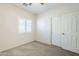 This bedroom features a ceiling fan, neutral paint colors and a window with shutters at 6317 S Kimberlee Way, Chandler, AZ 85249