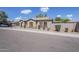 Charming one-story home boasts a low-maintenance front yard and desert landscaping under a clear, sunny sky at 6317 S Kimberlee Way, Chandler, AZ 85249