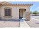 Inviting front entrance with a covered porch, neutral stucco, and tasteful landscaping at 6317 S Kimberlee Way, Chandler, AZ 85249