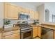 Kitchen showcasing stainless steel microwave, gas range, and granite countertops at 6317 S Kimberlee Way, Chandler, AZ 85249