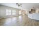 Bright open-concept living room showcasing tile flooring and large windows that flood the space with natural light at 6317 S Kimberlee Way, Chandler, AZ 85249