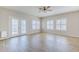Bright living room with double doors, tiled floors, plantation shutters and neutral paint creating a calming atmosphere at 6317 S Kimberlee Way, Chandler, AZ 85249